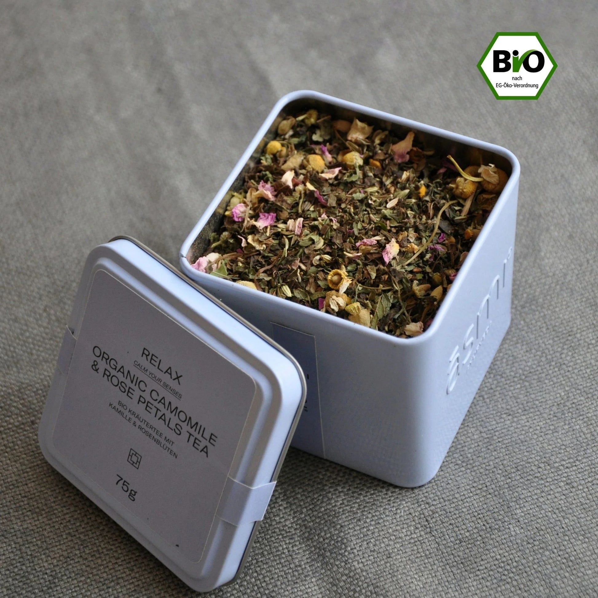 open tea tin with herbal tea