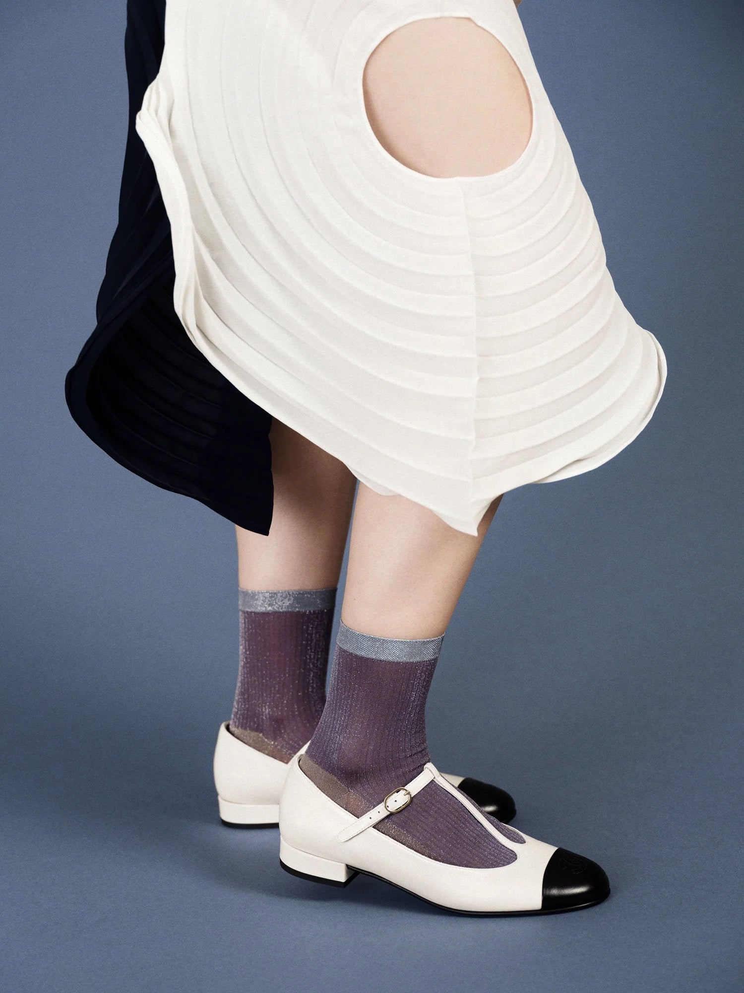 lady wearing white mary janes with twinkle short crew socks