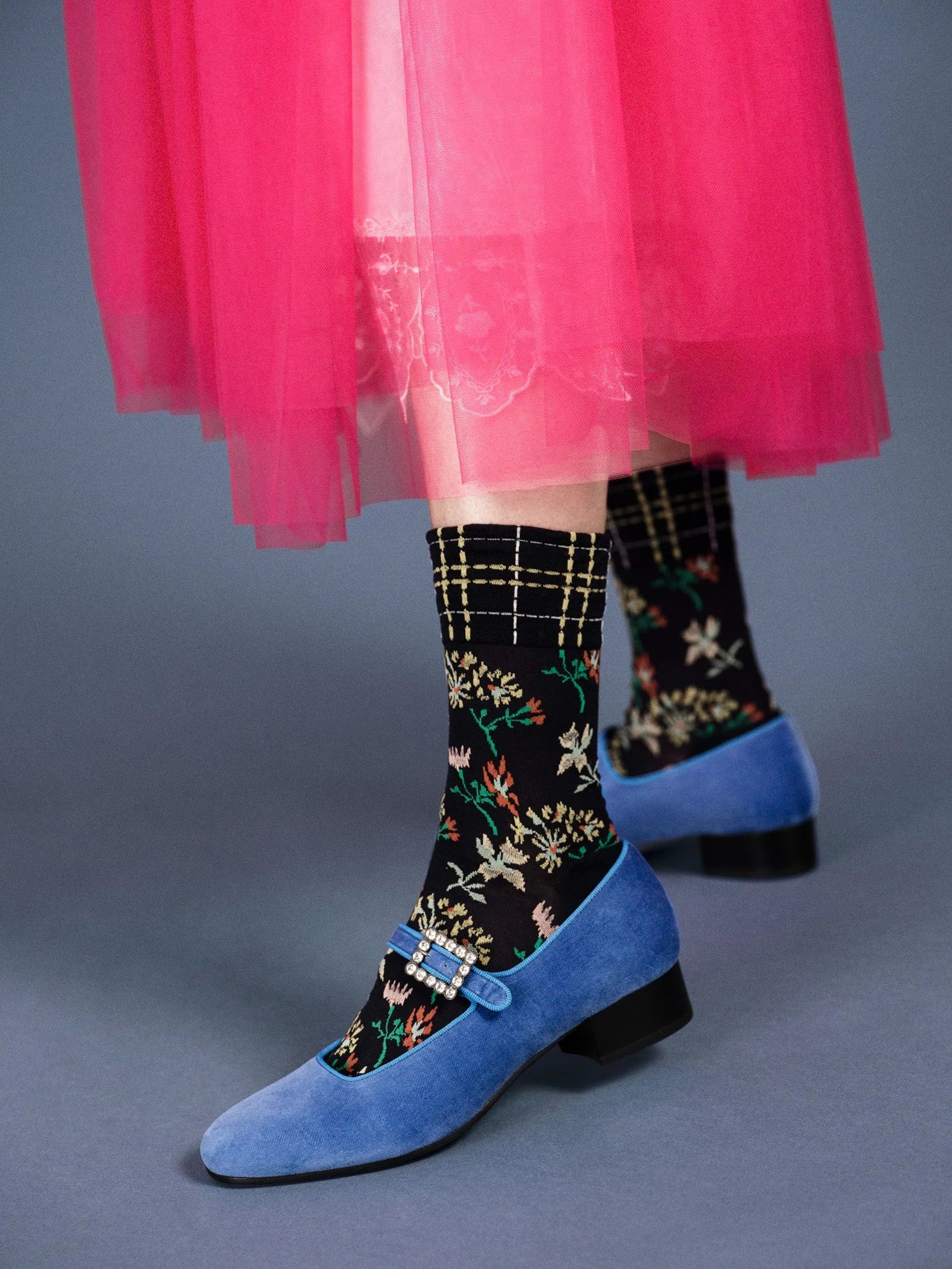 lady in pink skirt and blue shoes wearing zooey crew