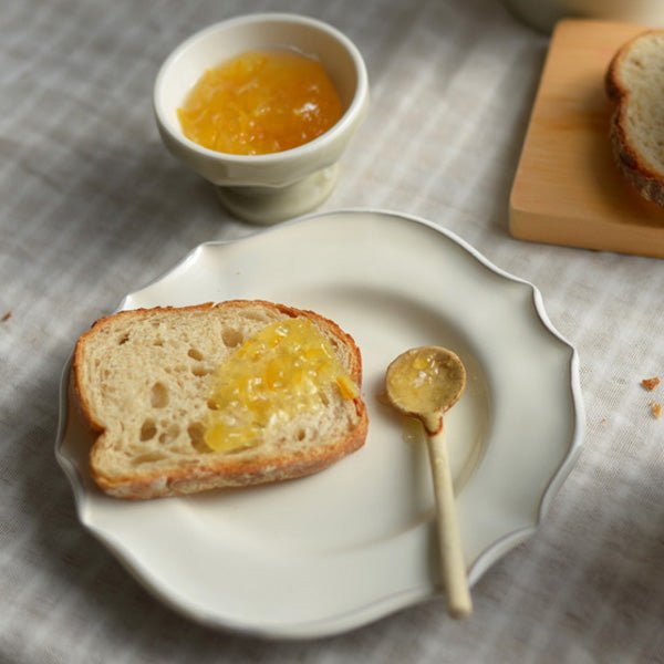 mame spoon next to toast and jam