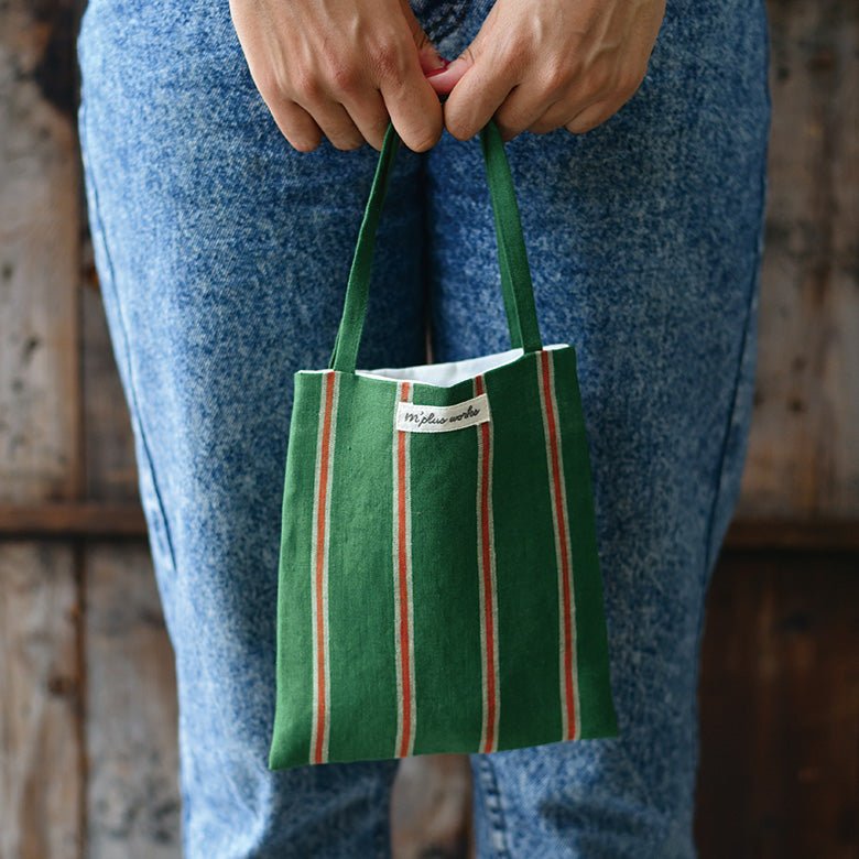 lady holding mini bag